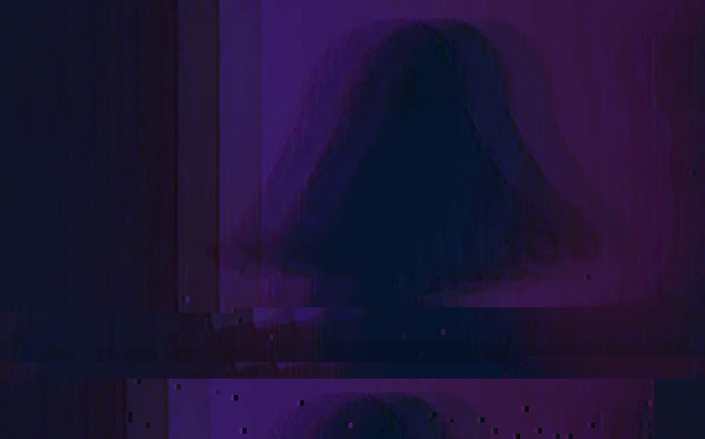Abstract, glitched photo of a lampshade or dome-shaped object in purple and blue tones, with digital distortion effects.